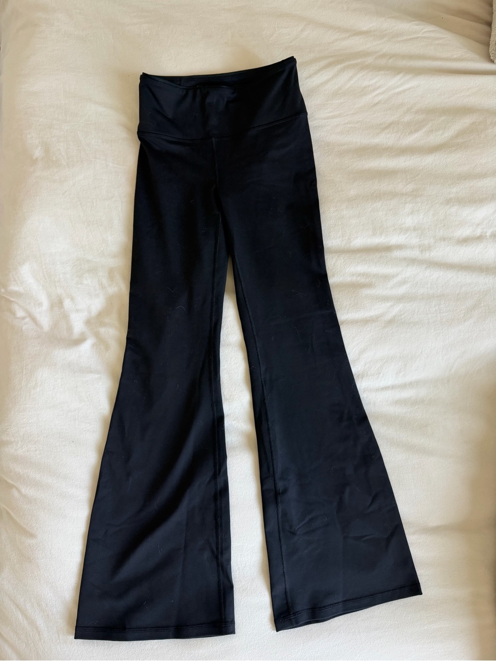 NEW with tags. Fabletics Black Flared Leggings. Back cross cross detail